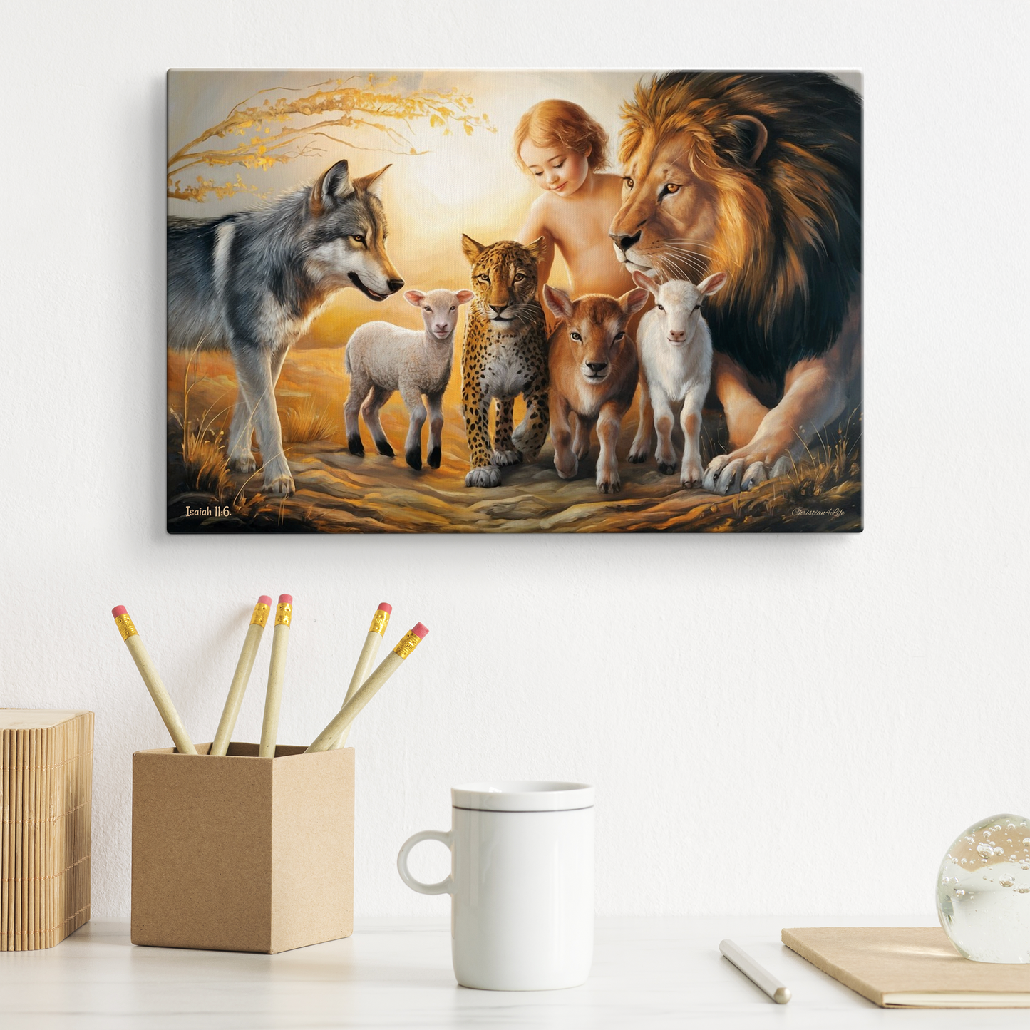 Canvas print of a diverse group of animals and a child against a sunset sky, displayed on a wall above a desk with stationery items.