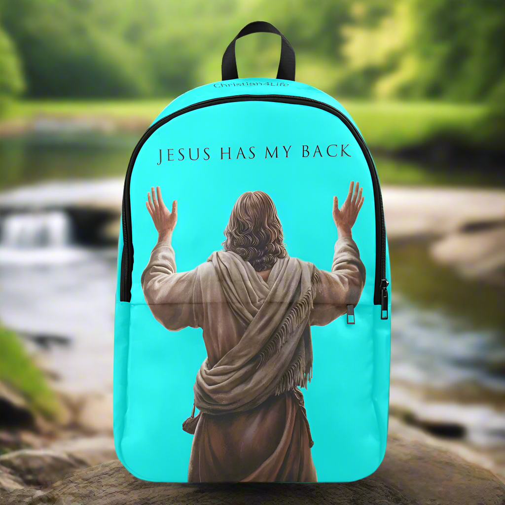 Backpack with 'Jesus Has My Back' text and image of Jesus in robes against a natural background.
