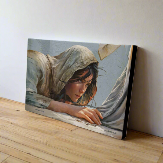 Canvas print of a woman with a hood leaning over, leaning against a white wall.