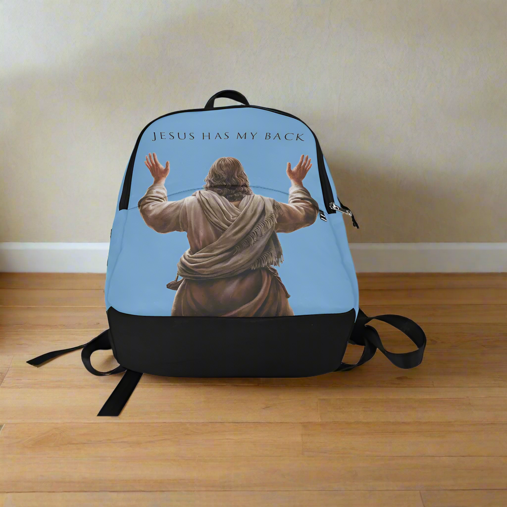 Backpack with 'Jesus Has My Back' text and image of Jesus on a wooden floor.