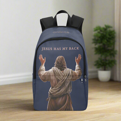 Backpack with 'Jesus Has My Back' text and image of Jesus on a wooden floor.