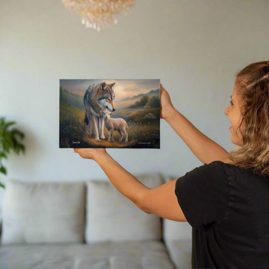 Woman hanging a painting of a wolf and a lamb