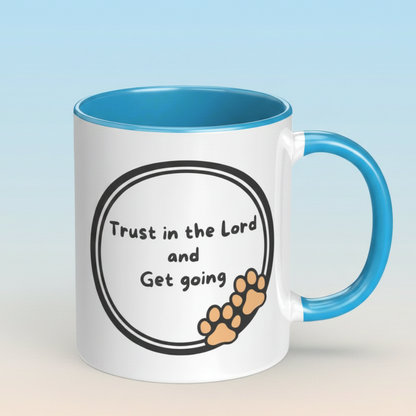 White mug with blue interior and handle featuring motivational text and paw prints on a light gradient background