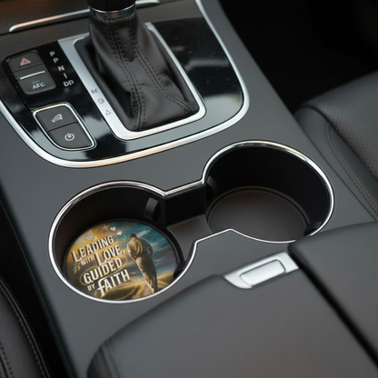 Car interior with a cup holder and gear shift, featuring a motivational coaster.