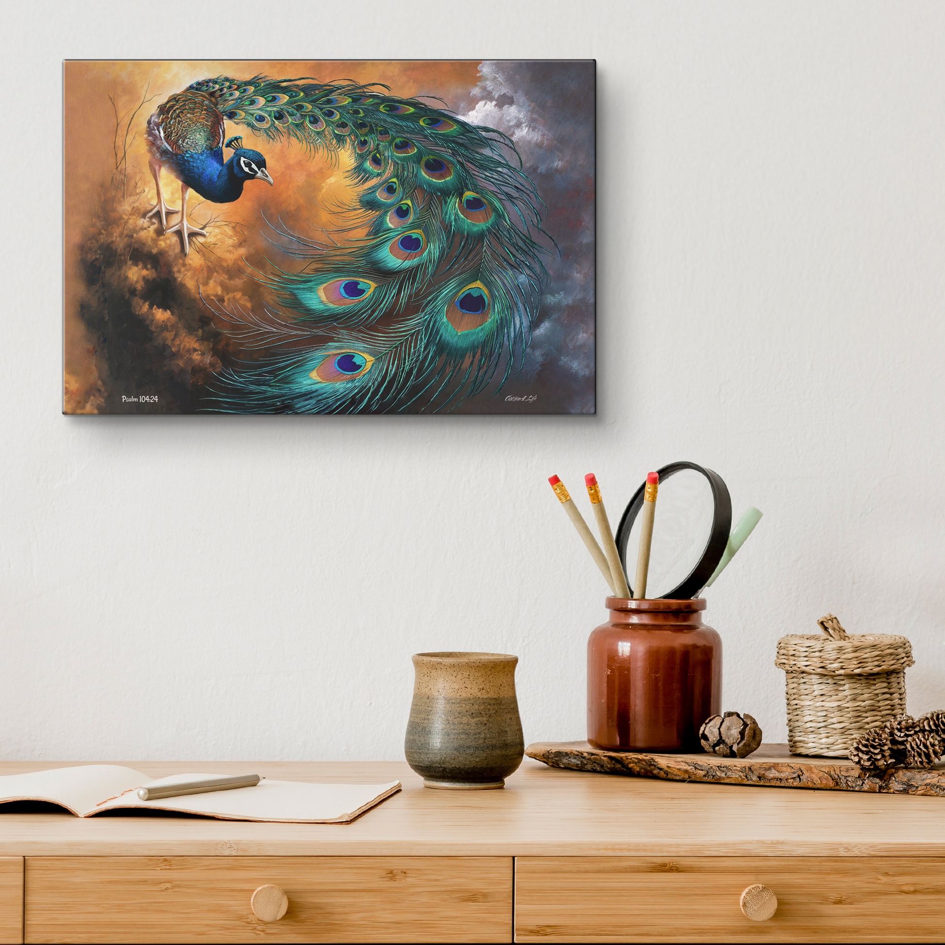 Peacock painting on a wall above a wooden desk with decorative items.