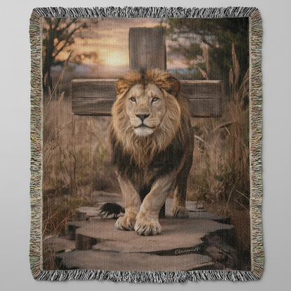Blanket with a lion design on a wooden platform, surrounded by grass and foliage.