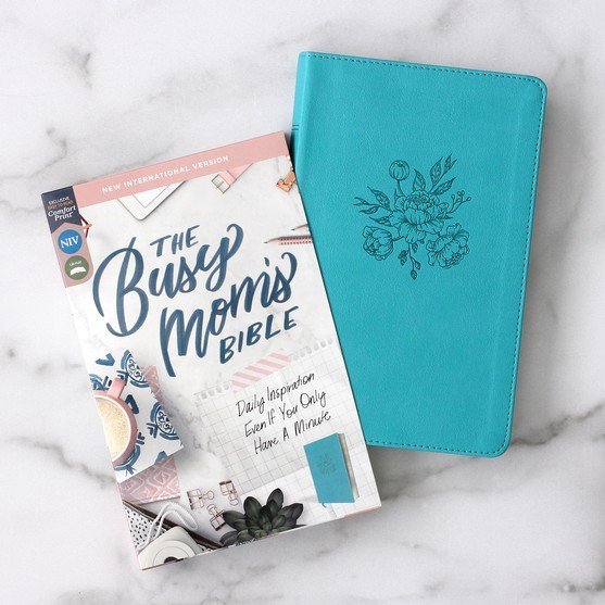 Teal Bible cover with floral design and 'The Busy Mom's Bible' on a marble surface
