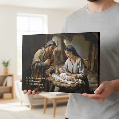 Person holding a framed artwork of a religious scene with Joseph, Mary and baby Jesus